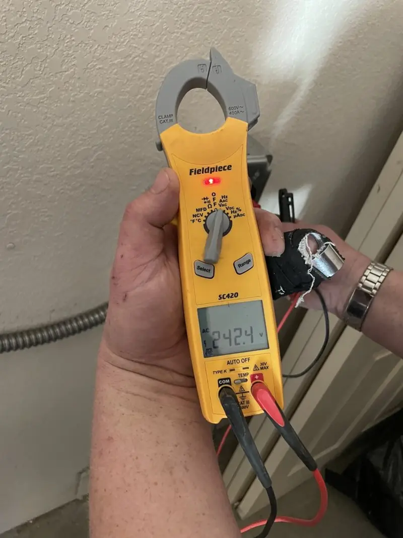 Voltage testing with clamp meter during Aluminum Wiring Replacement in Salmon